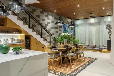 a kitchen with a dining table and a staircase at Luxury Resort of 4 villas 11 BR Seminyak in Seminyak