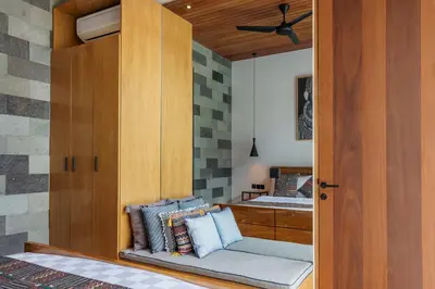 a bedroom with a bed with pillows on a bench at Luxury Resort of 4 villas 11 BR Seminyak in Seminyak