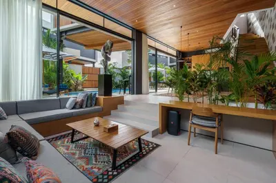 a living room with a couch and a table at Luxury Resort of 4 villas 11 BR Seminyak in Seminyak