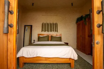 a bedroom with a large bed in a room at Casa Ombak in Kerobokan