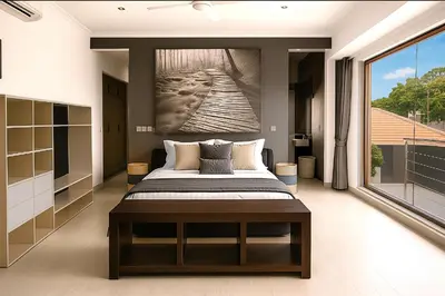 a bedroom with a bed and a large window at Villa Avrora Batubelig in Canggu