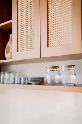 two glass jars sitting on a shelf in a kitchen at Arjuna Villa in Seminyak