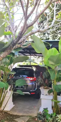 a car is parked in a parking lot at Villa Umah JD Umalas 3 kamar private pool in Canggu