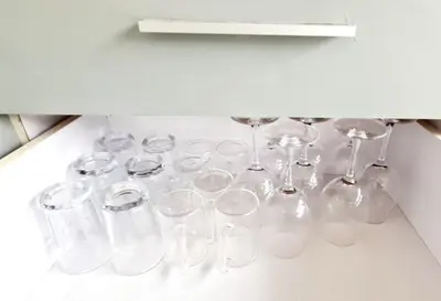 a bunch of wine glasses sitting on a shelf at Villa Umah JD Umalas 3 kamar private pool in Canggu