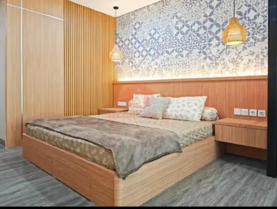 a bedroom with a bed with two pillows on it at Lavaya Resort 1BR Nusa Dua Pool, WiFi, Netflix in Nusa Dua