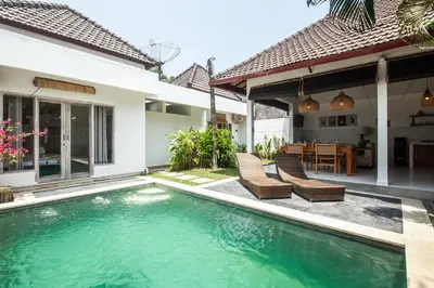 a swimming pool in the backyard of a villa at Homey Villa 2BR Seminyak in Seminyak