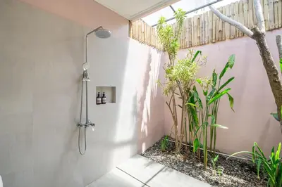 a shower in a bathroom with plants at Homey Villa 2BR Seminyak in Seminyak