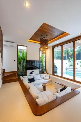 a living room with a couch and a table at 2BR Modern Mediterranean Villa Near Nook in Badung