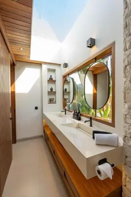 a bathroom with a sink and a mirror at 2BR Modern Mediterranean Villa Near Nook in Badung