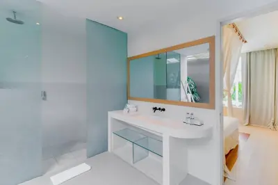 a bathroom with a sink and a mirror at Berawa -Ocean View 5 Bed, Walk to Beach, Sleeps 10 in Canggu