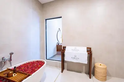 a room with a tub filled with red roses at Karaya Villas Umalas - Free In-Villa Culture Immersion Programs in Kerobokan