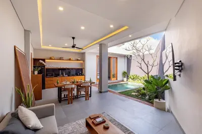 an open living room with a dining room and a kitchen at Karaya Villas Umalas - Free In-Villa Culture Immersion Programs in Kerobokan