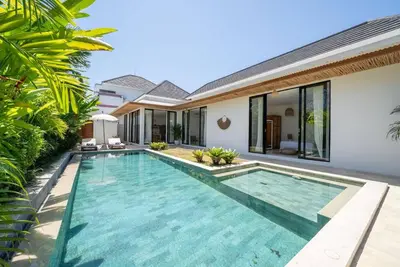 an image of a swimming pool in front of a villa at Villa Amie Elegant 5BR with Pool & Rooftop Umalas in Canggu