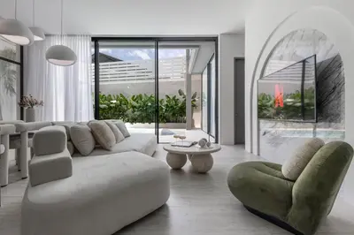 a living room with a couch and a chair at Brand New Luxury Design Villa by Amare Villas 4 in Badung