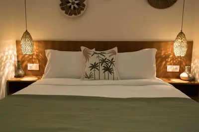 a bedroom with a bed with white sheets and pillows at Villa Teide by BaliSuperHost in Canggu