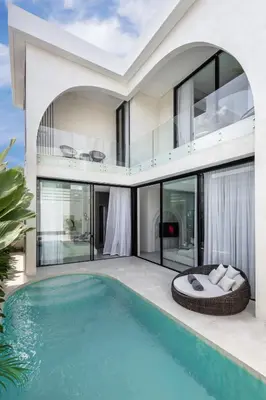an exterior view of a house with a swimming pool at Brand New Luxury Design Villa by Amare Villas 2 in Badung