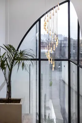 a room with a potted plant and a chandelier at Brand New Luxury Design Villa by Amare Villas 2 in Badung