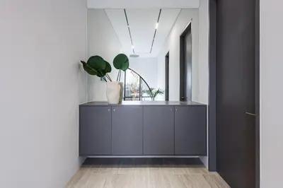 a hallway with a cabinet with plants in it at Brand New Luxury Design Villa by Amare Villas 2 in Badung