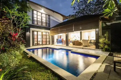 a swimming pool in the backyard of a house at Vase 2BR Villa Seminyak in Seminyak