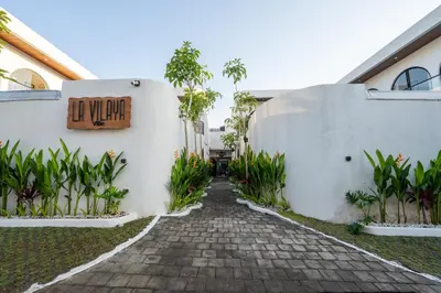 a walkway outside of a building with a sign on it at La Vilaya Villa in Kerobokan