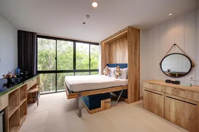 a bedroom with a bed and a mirror at Anagata Tanjung Benoa 4 in Nusa Dua