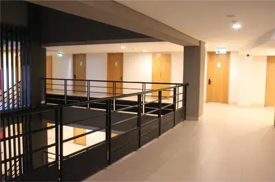 an empty hallway with stairs in a building at Anagata Tanjung Benoa 4 in Nusa Dua
