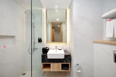 a bathroom with a sink and a glass shower at Anagata Tanjung Benoa 4 in Nusa Dua