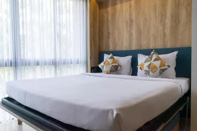 a bedroom with a large bed with white sheets and pillows at Anagata Tanjung Benoa 4 in Nusa Dua