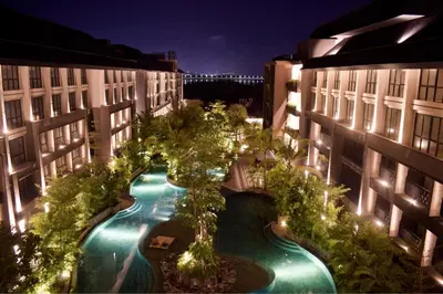 an overhead view of a pool between two buildings at night at Anagata Tanjung Benoa 4 in Nusa Dua