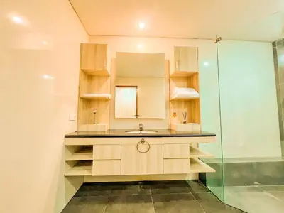 a bathroom with a sink and a shower at Jasmine Villa in Nusa Dua