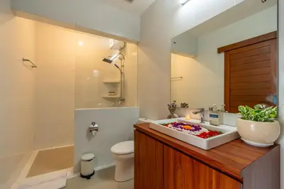a bathroom with a sink and a toilet and a tub at Mich Bali Villa Two-Bedroom Private Pool Kuta in Seminyak
