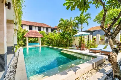 a swimming pool in the backyard of a villa at Aileen 4 BR Private Pool Villa in Seminyak