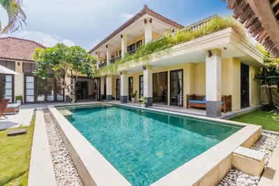 an exterior view of a house with a swimming pool at Aileen 4 BR Private Pool Villa in Seminyak