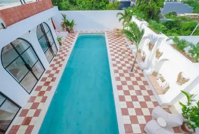 an overhead view of a swimming pool in a house at Ocean View 4BR Design Villa with Lap Pool & Rooftop Jacuzzi in Jimbaran