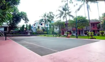 a tennis court with a tennis racket on it at Apartemen 6236 at Jayakarta Residence Bali in Seminyak