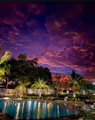 a night view of a swimming pool at a resort at Apartemen 6236 at Jayakarta Residence Bali in Seminyak