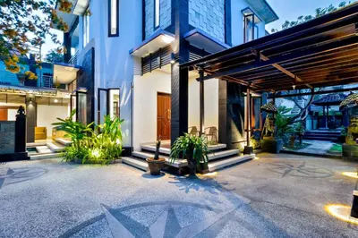a house with a courtyard with plants at Balinese Home with Pool near Padma Beach, Legian in Legian