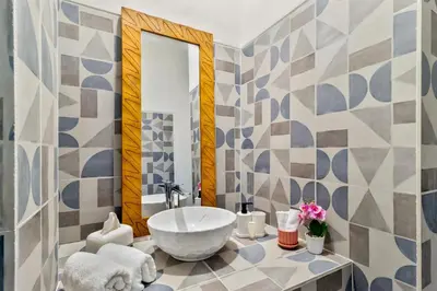 a bathroom with a sink and a mirror at Balinese Home with Pool near Padma Beach, Legian in Legian