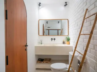 a bathroom with a sink and a toilet and a mirror at Harbie Villa 1 in Seminyak