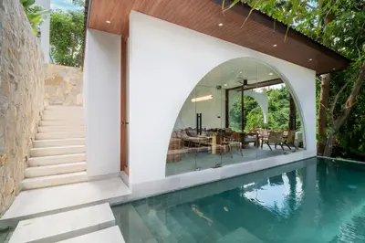 an external view of a house with a swimming pool at Villa Lalalax 3BR Tropical Retreat in Jimbaran in Uluwatu
