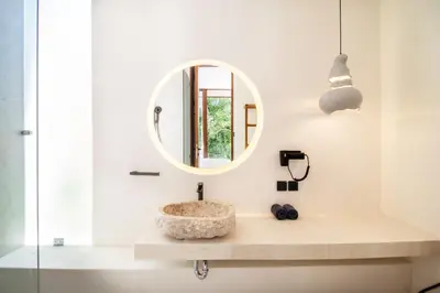 a bathroom with a sink and a mirror at Villa Lalalax 3BR Tropical Retreat in Jimbaran in Uluwatu