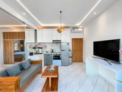a living room with a couch and a table at Villa Diah in Seminyak
