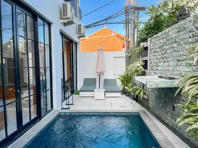 a swimming pool in the backyard of a house at Villa Diah in Seminyak
