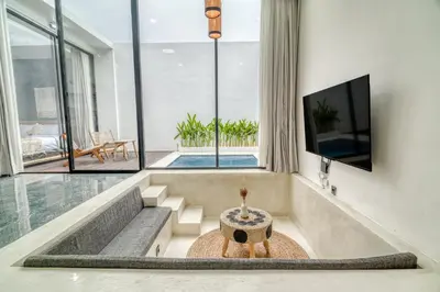 a living room with a fire pit in the middle at FYM LOVE VILLA Residence BALI in Kerobokan