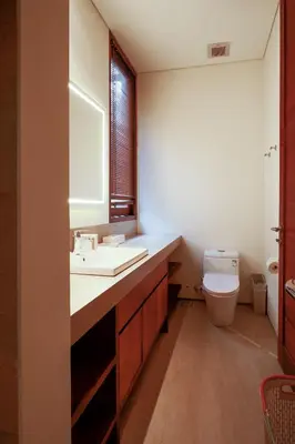a bathroom with a sink and a toilet at Bali Radiance 4 bedrooms with private bathrooms - Pool, Beach & Airport in Ngurah Rai International Airport