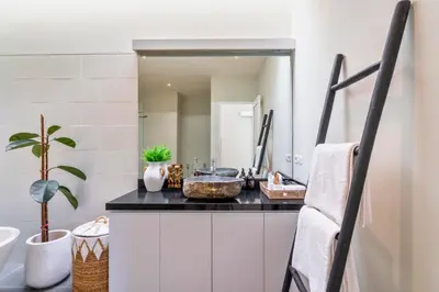 a bathroom with a sink and a mirror at Ardelle 2 BR Private Pool Villa in Canggu