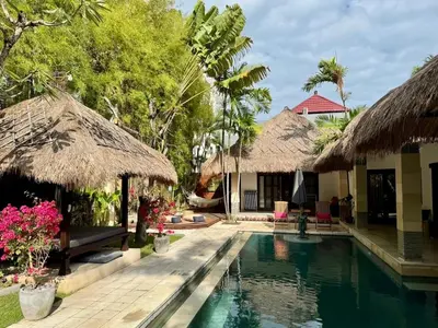 a villa with a swimming pool in a resort at Villa Evelyne, Luxury Villa, Fully Staffed, Central Seminyak in Seminyak