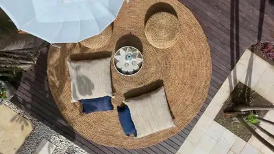 an overhead view of a wicker bench with an umbrella at Villa Evelyne, Luxury Villa, Fully Staffed, Central Seminyak in Seminyak