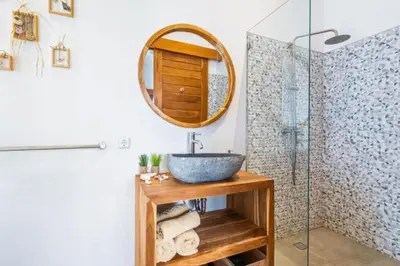 a bathroom with a sink and a mirror at Avery 1 BR Private Pool Villa in Seminyak