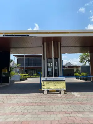 a building with a bench in front of it at Villa Bun Blessi in Pesanggaran